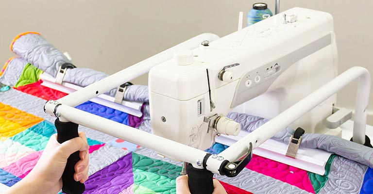 Quilting machines offer a larger workspace & many include an extension <br>table to give you room to move and maneuver as you quilt.