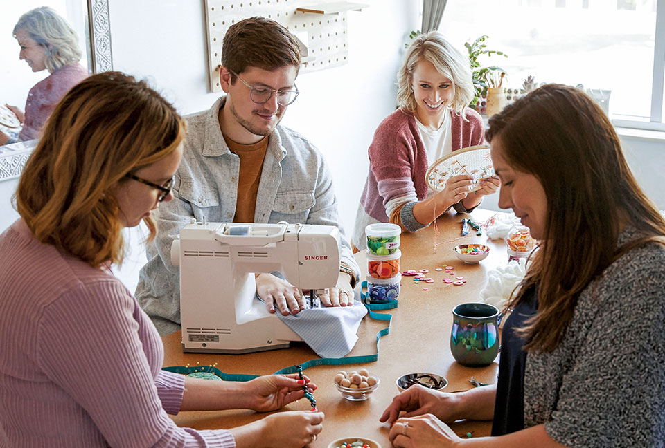 People in a class sewing and crafting together