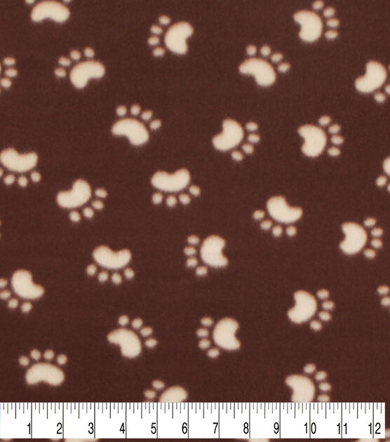 Blizzard Fleece Fabric  Paw Prints on Brown