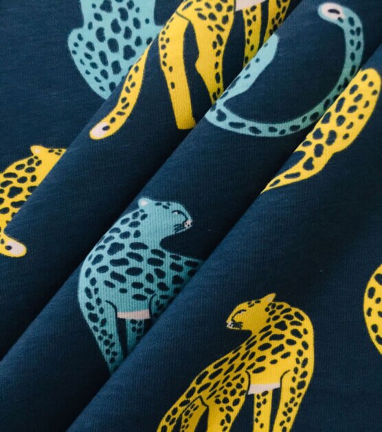 POP! Cheetah Icons on Dark Blue Jersey Knit Fabric | JOANN