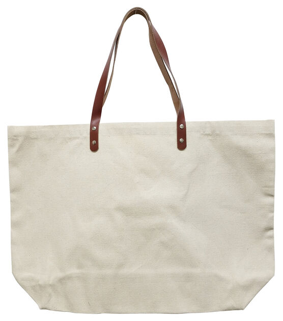 Large canvas tote shopping bag with leather pockets and handles