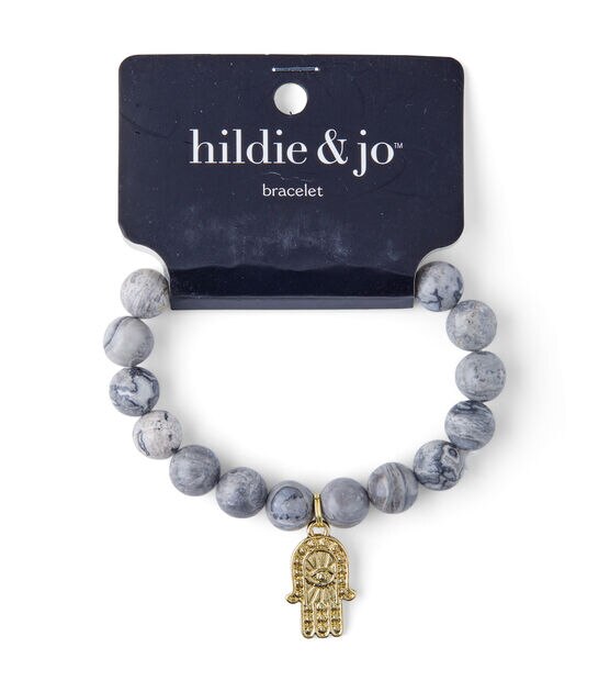 Gray Beaded Stretch Bracelet With Gold Hamsa Charm by hildie & jo