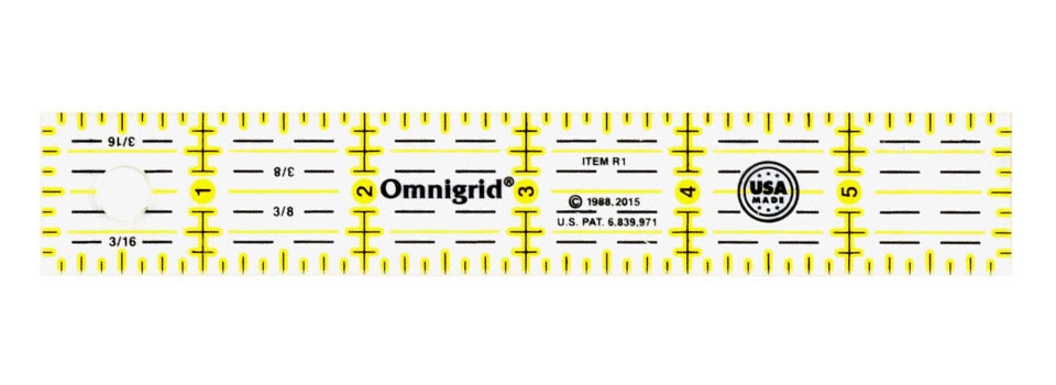 white, black, and yellow rotary cutting ruler