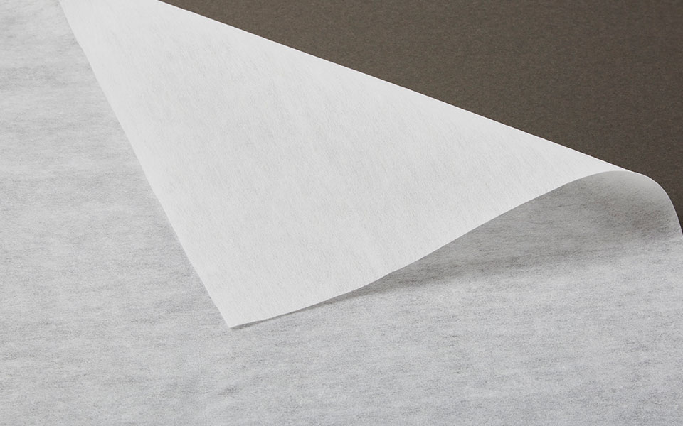folder over corner of white non-woven interfacing fabric