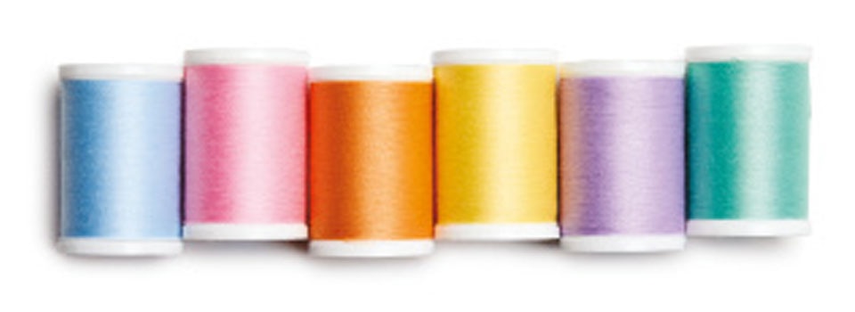 blue, pink, orange, yellow, purple, and green thread side by side